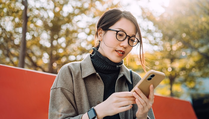 Woman working on phone
