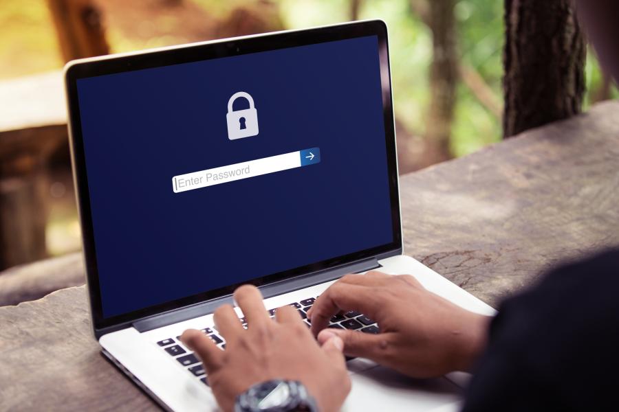 man navigating security screen on laptop